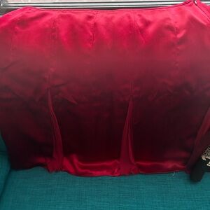Red skirt with pleats.